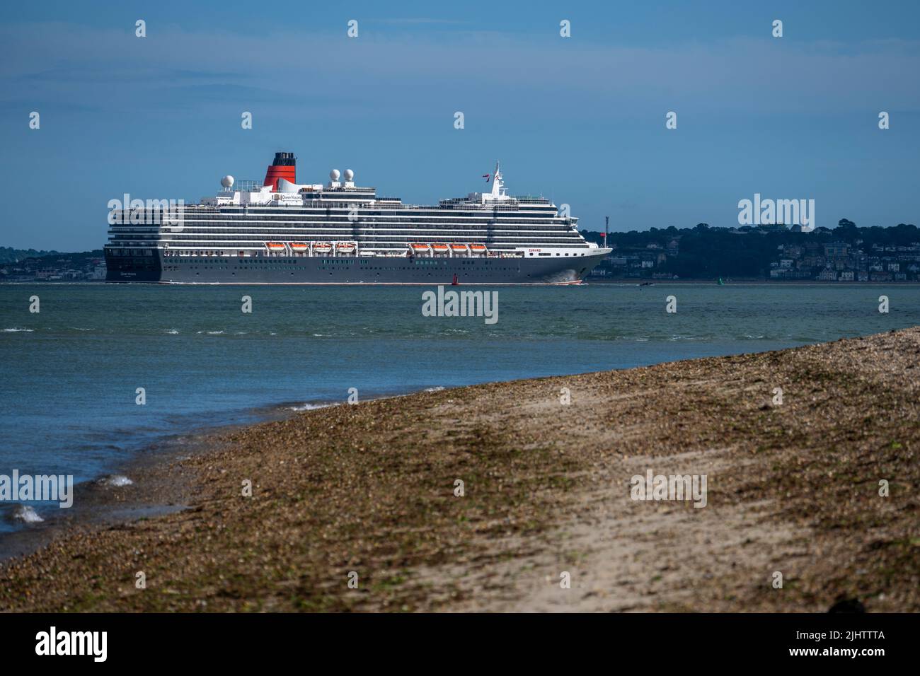 Cunard’s ‘Queen Victoria’ sailing past Calshot after leaving Southampton Docks. Stock Photo
