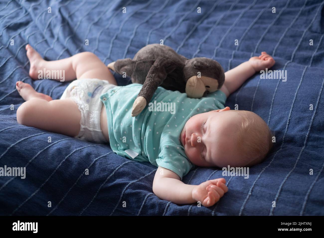 Cute little baby sleeping on bed at home Stock Photo Alamy