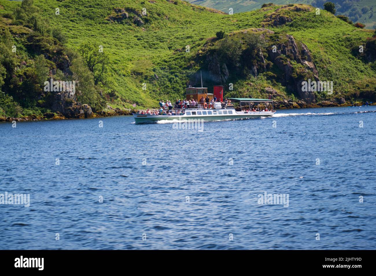 Ullswater Steamer travelling along the lake in Summer, Lake District Stock Photo