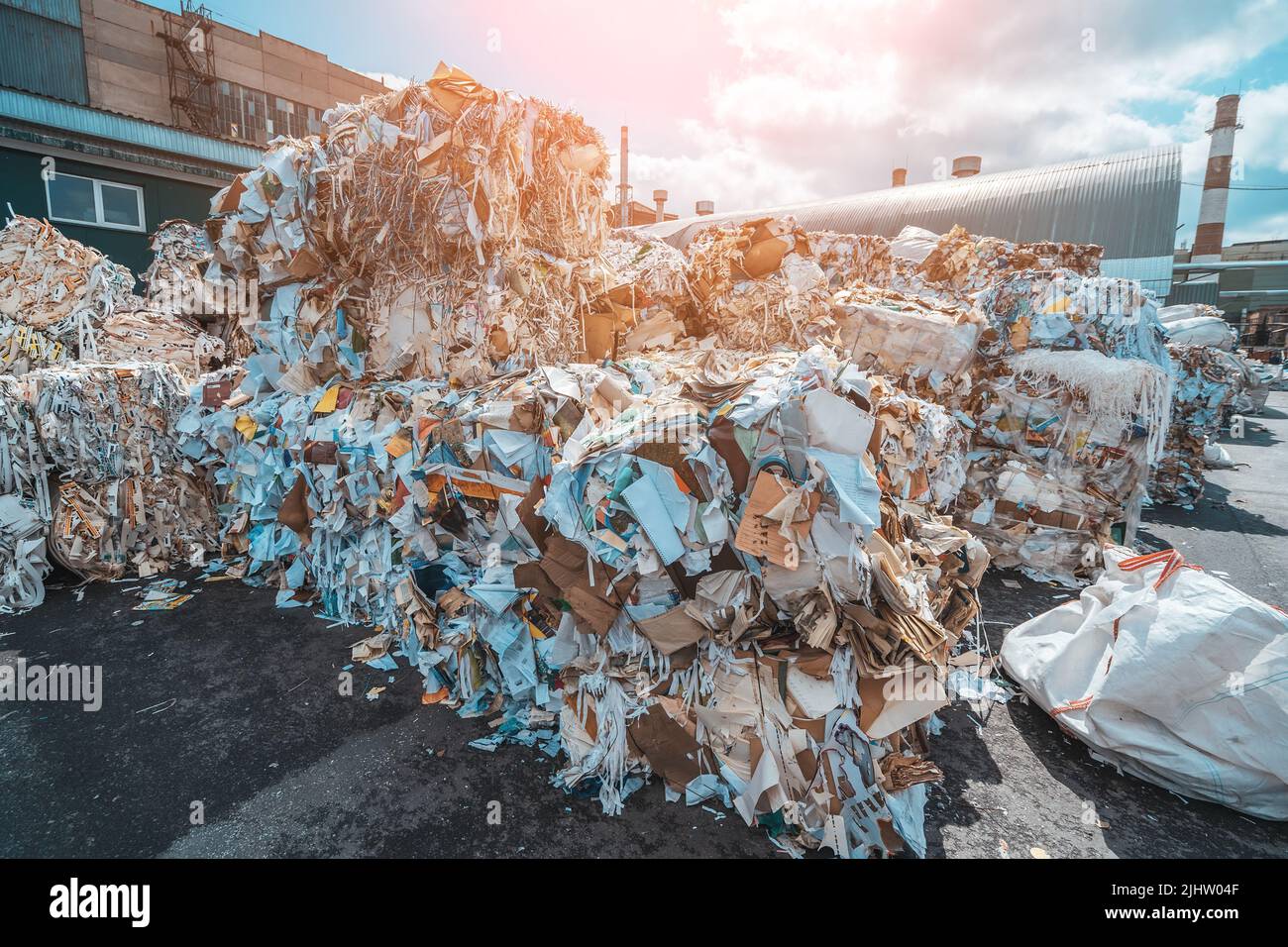 Waste paper for sorting and filing for processing at paper recycling plant. Production of new paper from garbage. Stock Photo