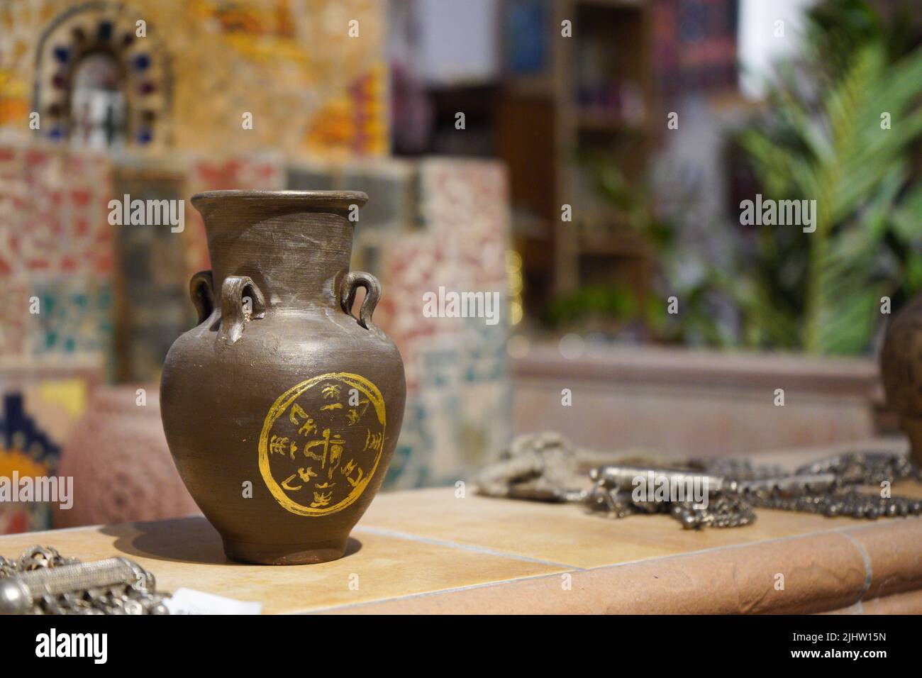 Pottery, a vase, a jug of brown clay, and the founding day of Saudi Arabia are isolated in a Saudi heritage museum. khobar, saudi arabia. Stock Photo