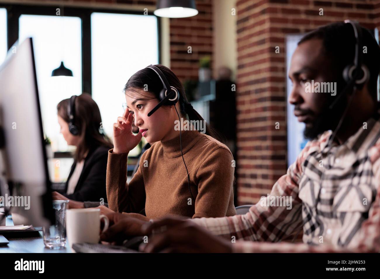 Call centre operator using telephone hi-res stock photography and ...