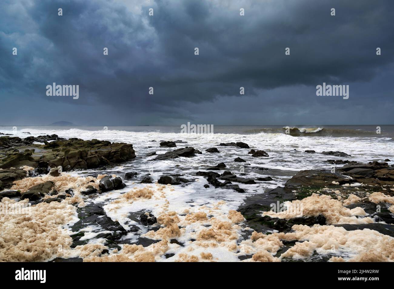 A rocky foreshore after heavy storms and rains Stock Photo - Alamy
