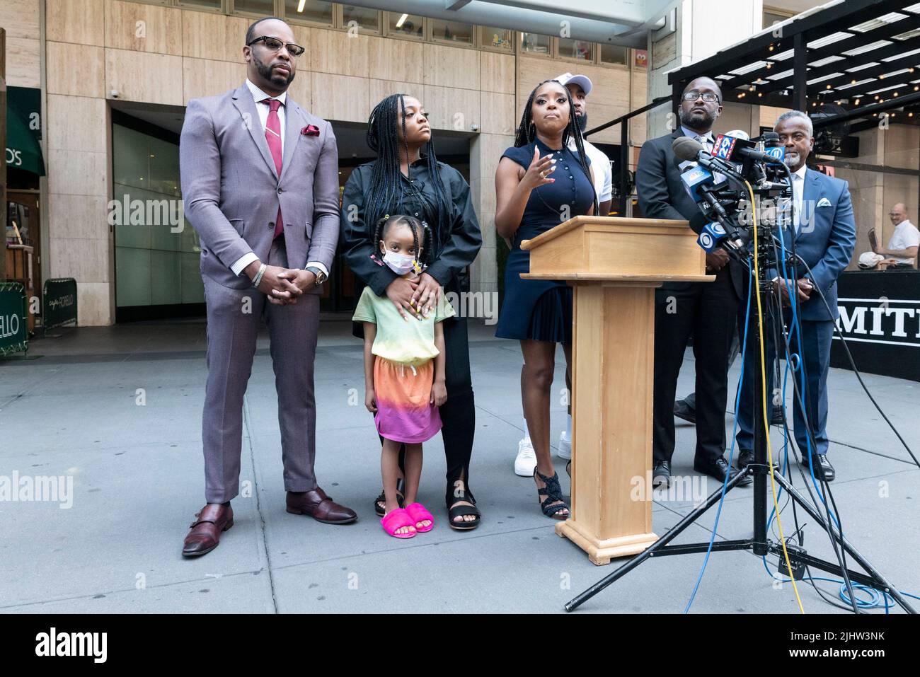 New York, New York, USA. 20th July, 2022. Left is attorney B'IBORY LAMARR, JODI BROWN and her niece NILAH listen Social justice leader TAMIKA MALLORY of Until Freedom address the media about discriminatory behavior by Sesame Place performers during a news conference in front of the Sesame Place Workshop in New York. Earlier Sesame Place performers have been shown to ignore and bully small Black children, including Nilah, during a recent viral video at the Langhorne, PA theme park. (Credit Image: © Brian Branch Price/ZUMA Press Wire) Credit: ZUMA Press, Inc./Alamy Live News Stock Photo