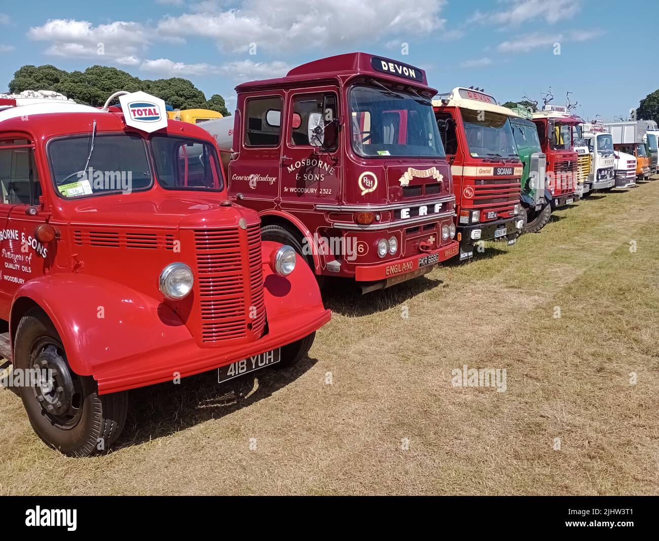 A line of classic commercial lorries parked on display at the 47th