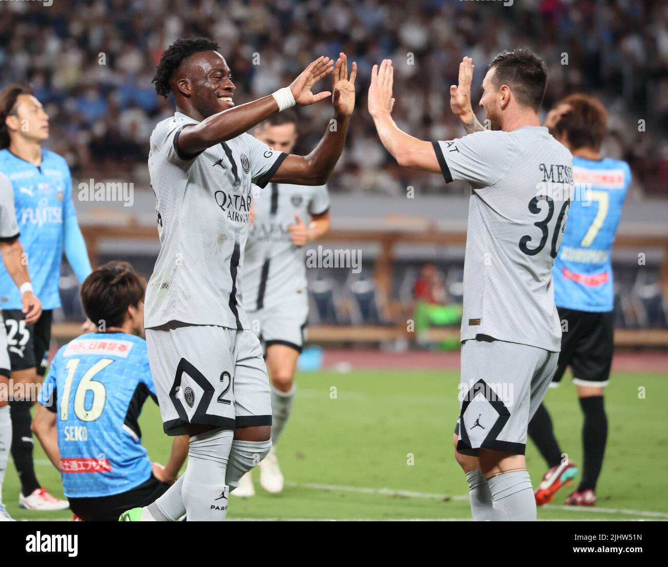 Tokyo, Japan. 20th July, 2022. French football club team Paris Saint-Germain forward Arnaud Kalimuendo (L) is celebrated by Lionel Messi as Messi assisted Kalimuendo's goal during an international friendly match against Japan's Kawasaki Frontale at the national stadium in Tokyo on Wednesday, July 20, 2022. Paris Saint-Germain defeated Kawasaki Frontale 2-1 at the firts game of their Japan tour. Credit: Yoshio Tsunoda/AFLO/Alamy Live News Stock Photo