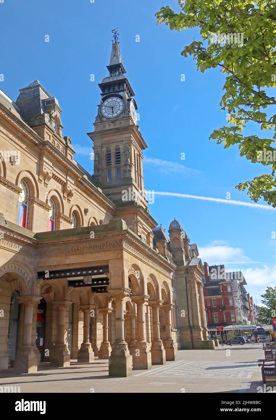 The Atkinson on Lord Street, Southport, stands in bright summer sunshine beneath a clear blue sky,tall clock tower forming one of the most distinctive Stock Photo