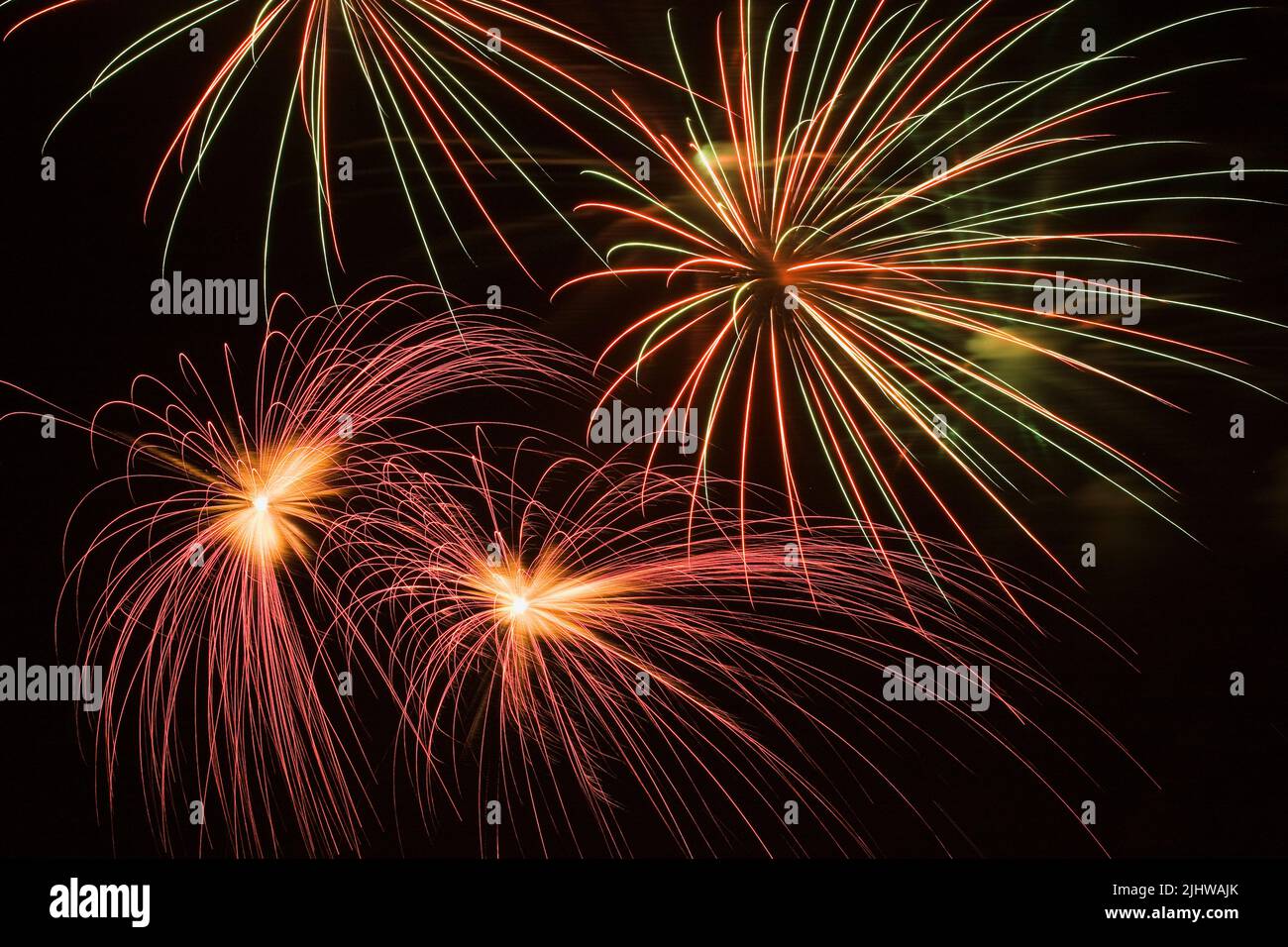 Red,green and white fireworks in the night sky, Quebec, Canada Stock Photo