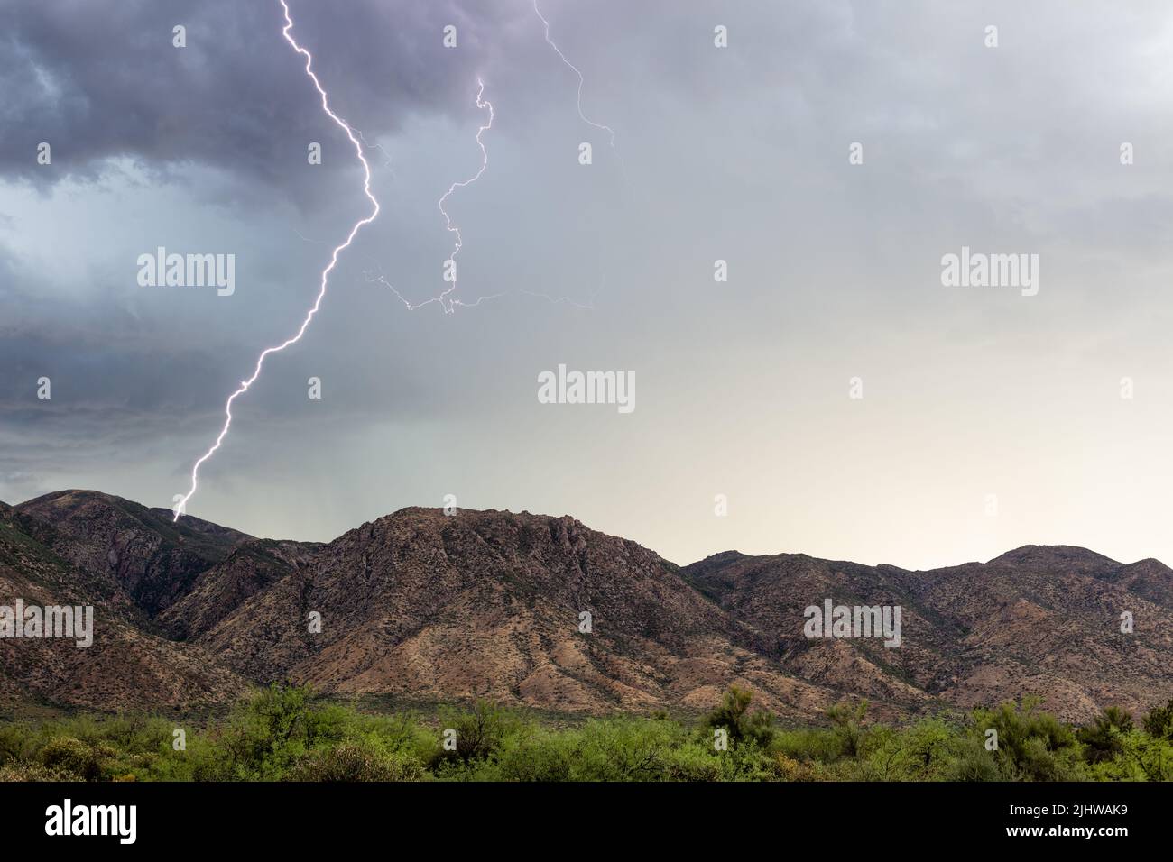 Lightning strike hitting a ridge in the Mazatzal Mountains near Tonto Basin, Arizona Stock Photo