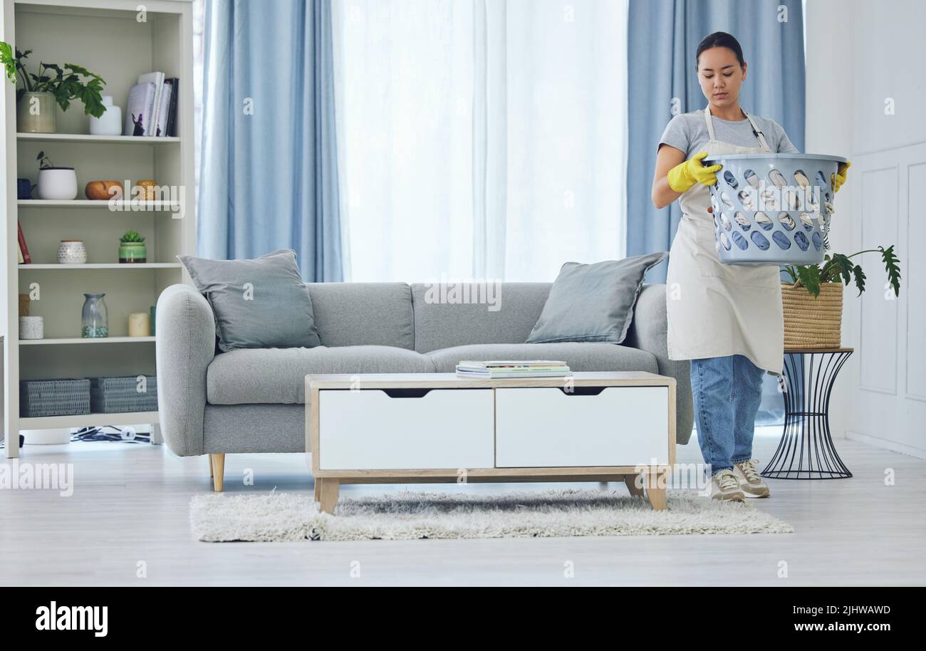 Doing chores is free therapy. a young woman cleaning up at home. Stock Photo