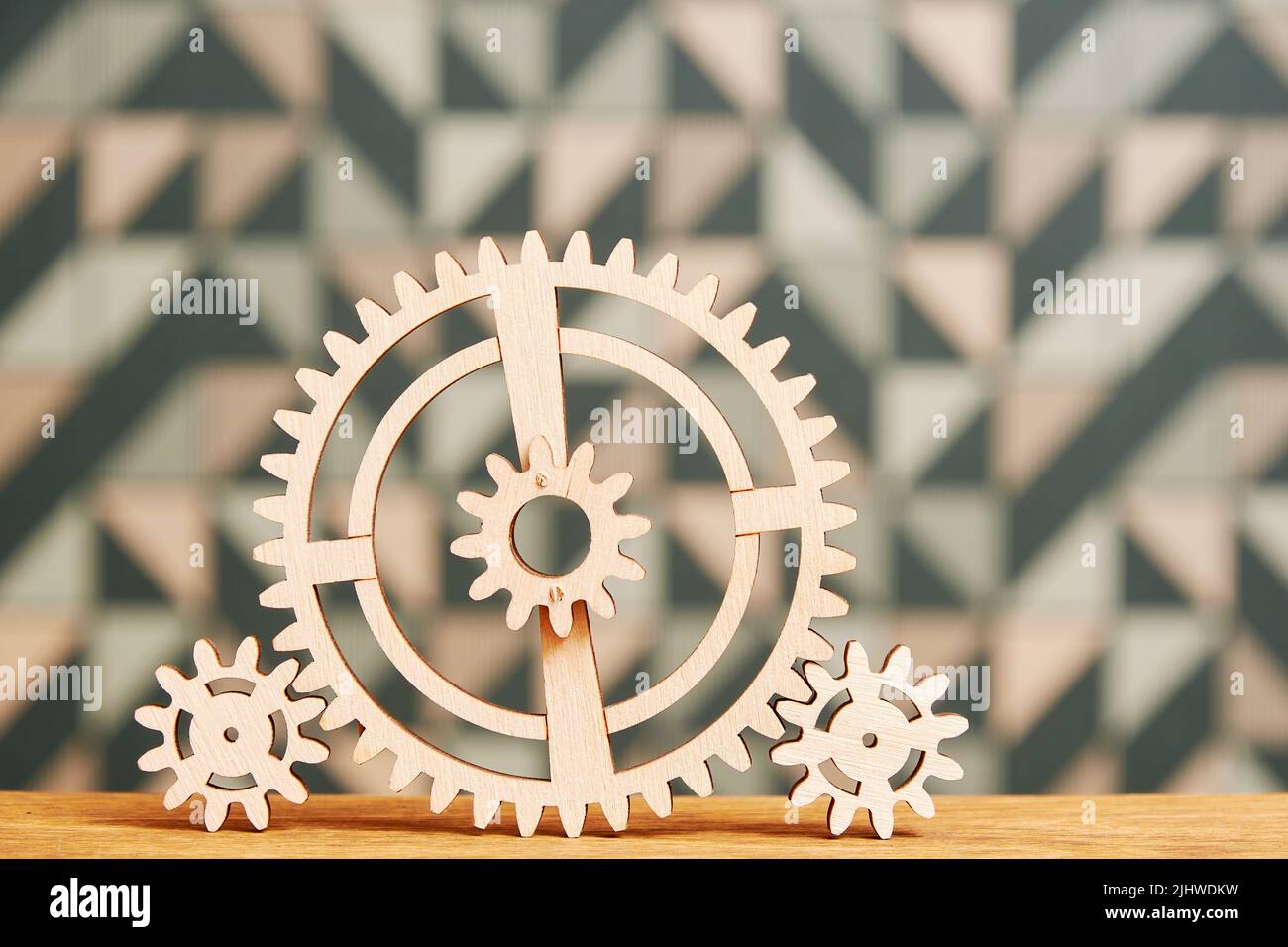 Mechanism for wooden gears on a wooden table. Teamwork concept. Kids