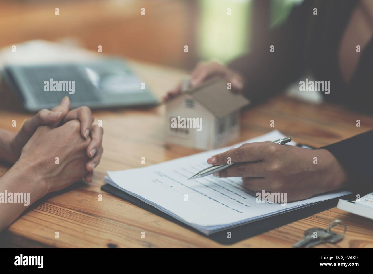 Close up Business woman or Real Estate agent giving house key after ...