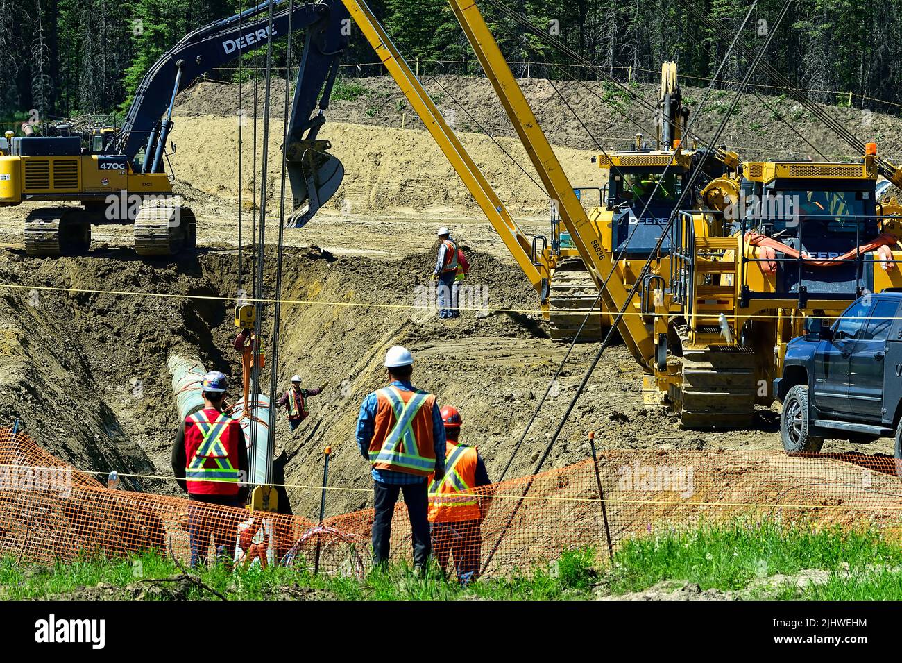 Workers laying the Trans Mountain Pipeline in rural Alberta Canada Stock Photo