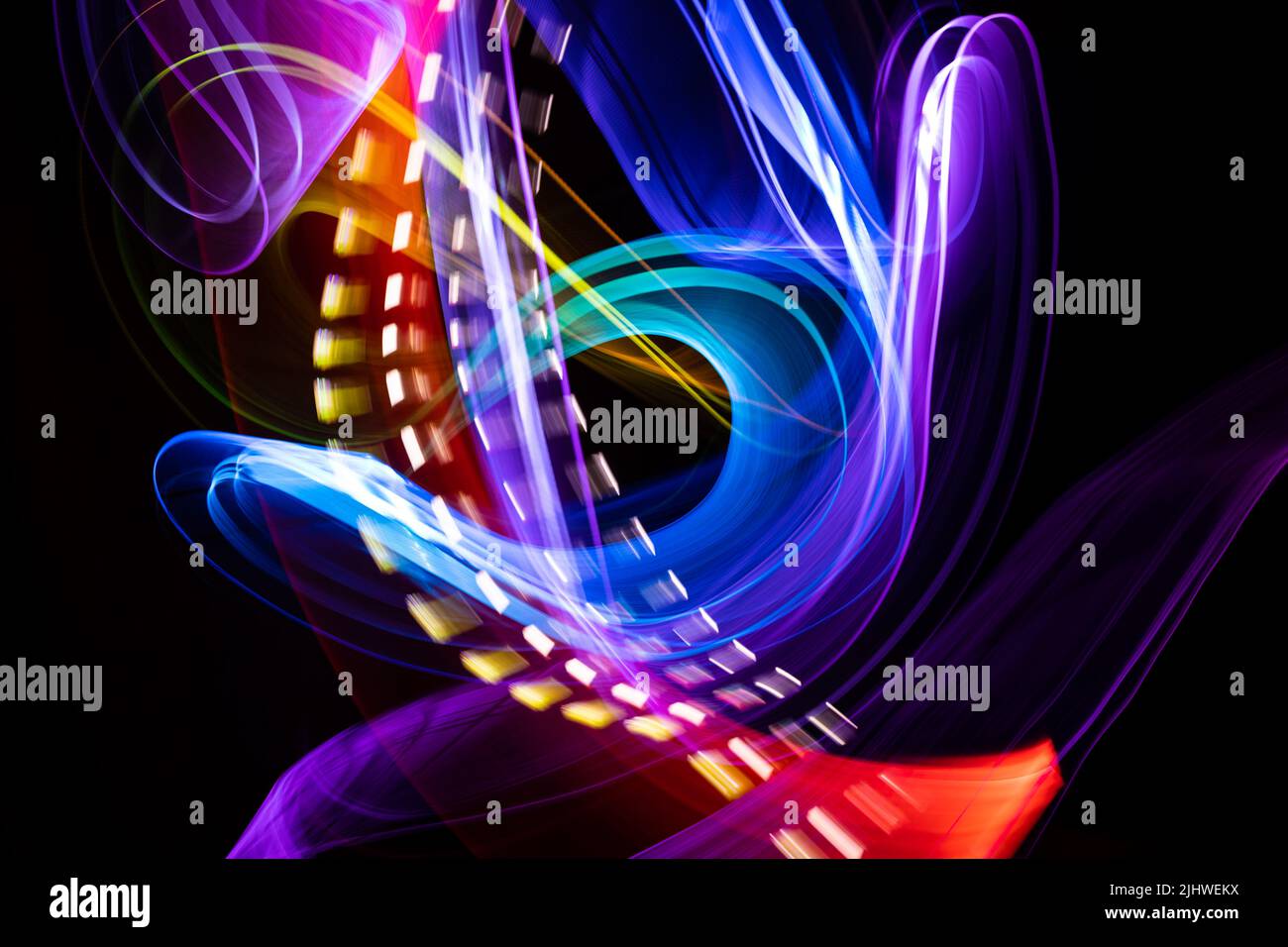 light painting photography with long exposure. abstract art made with light. futuristic-looking ...