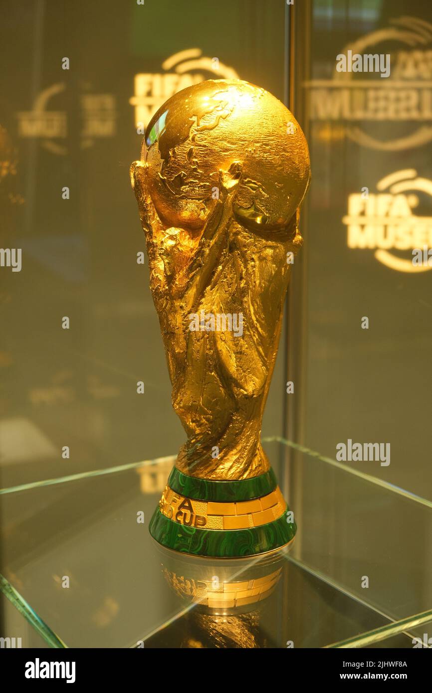 A vertical shot of the Fifa World Cup trophy displayed to the crowd in
