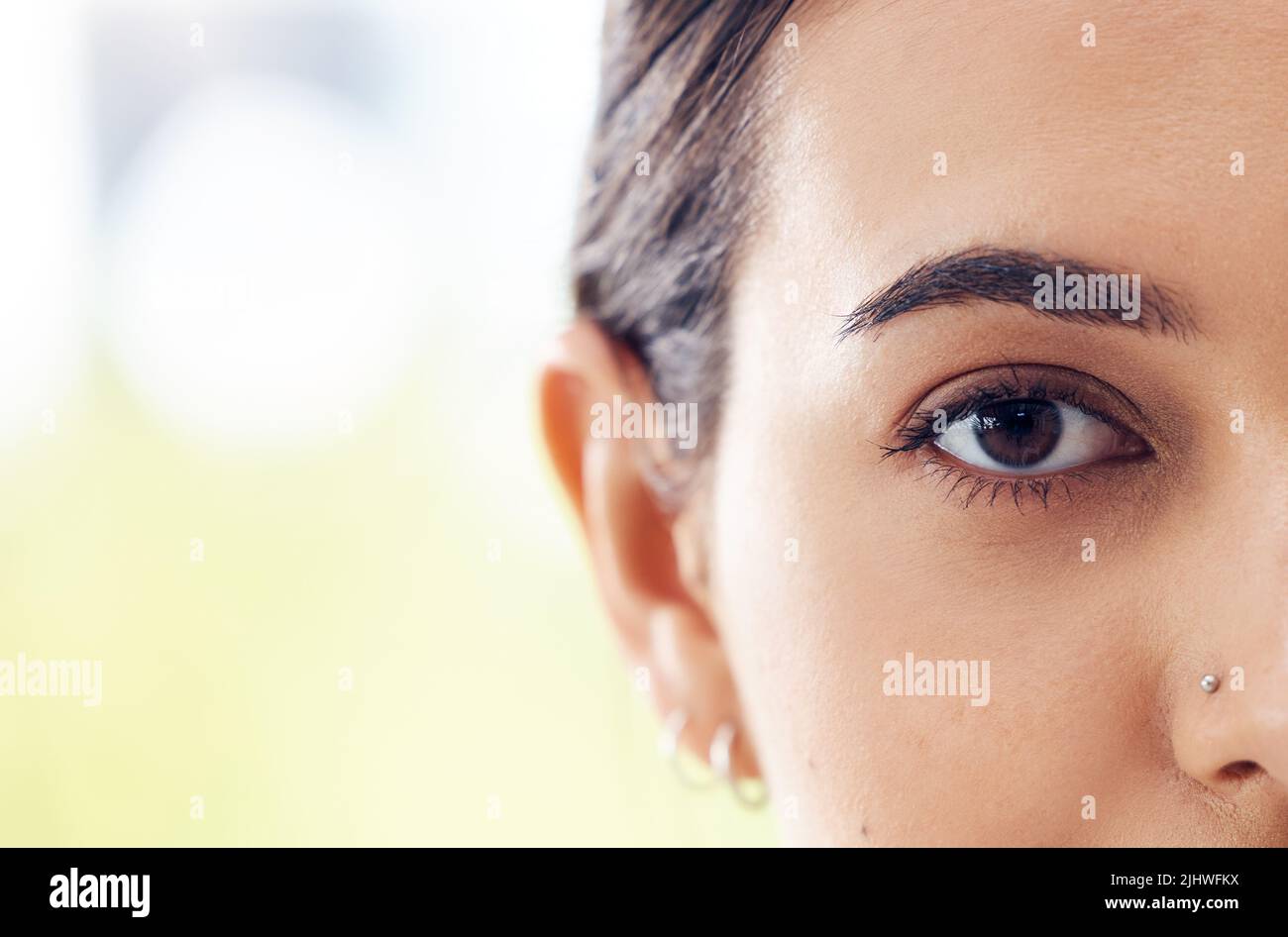 Life is about seeing the deeper meaning. Closeup shot of a young woman staring ahead of her. Stock Photo