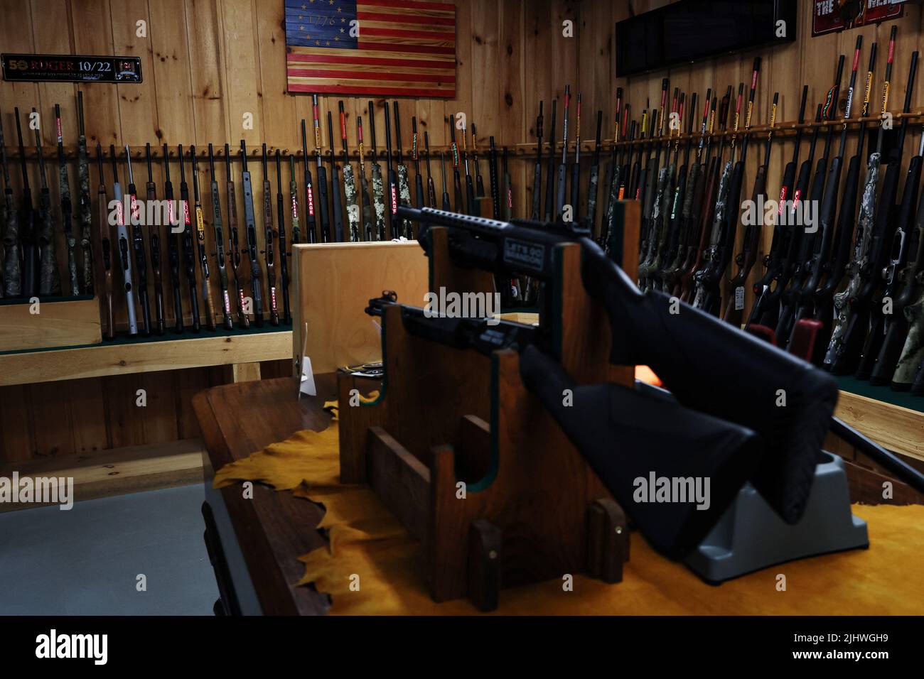 Various types of firearms are displayed at Calamity Jane's Firearms and Fine Shoes in Hudson Falls, New York, U.S., July 20, 2022. REUTERS/Shannon Stapleton Stock Photo
