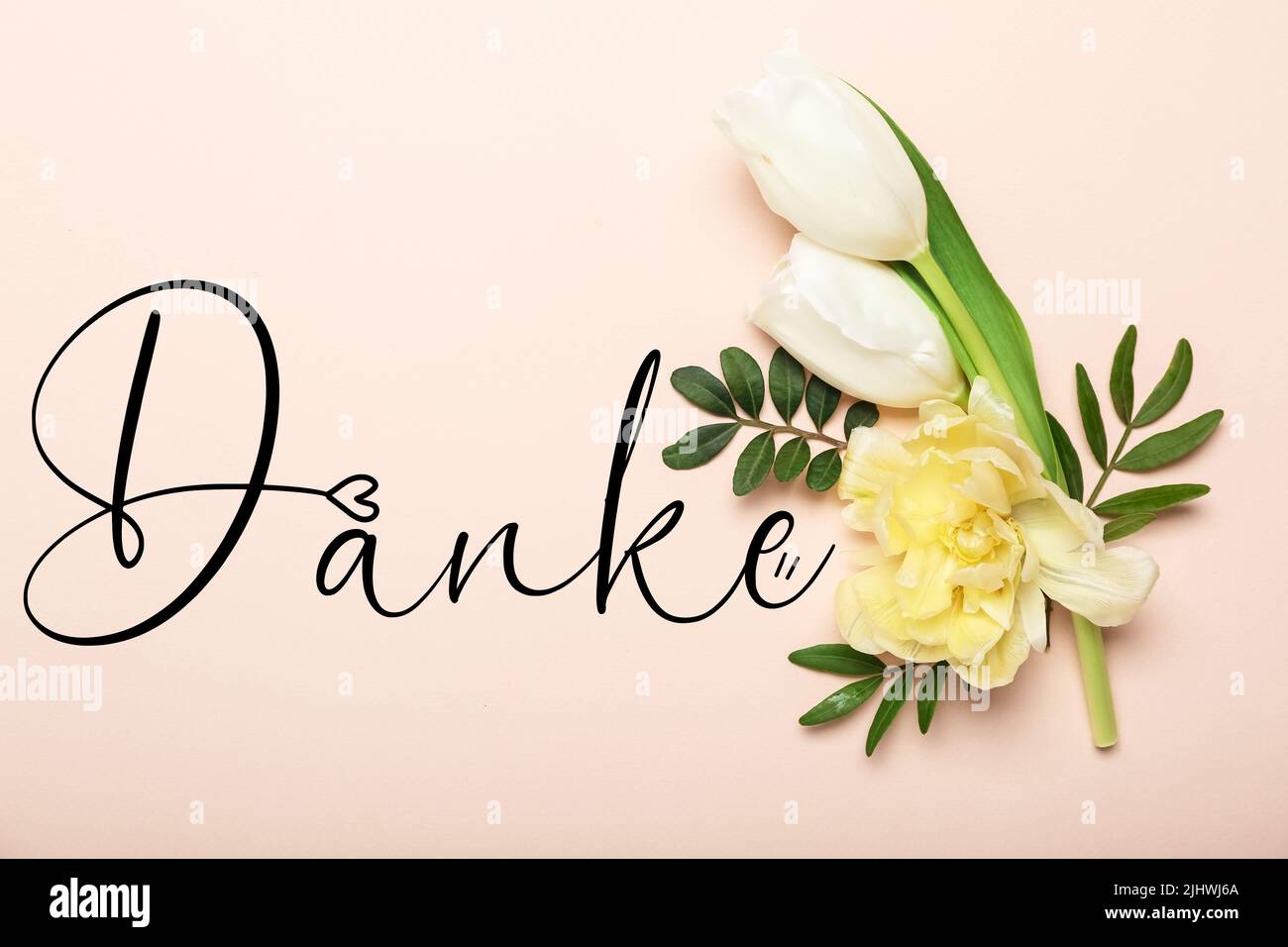 Beautiful flowers and word DANKE (German for Thanks) on pink background