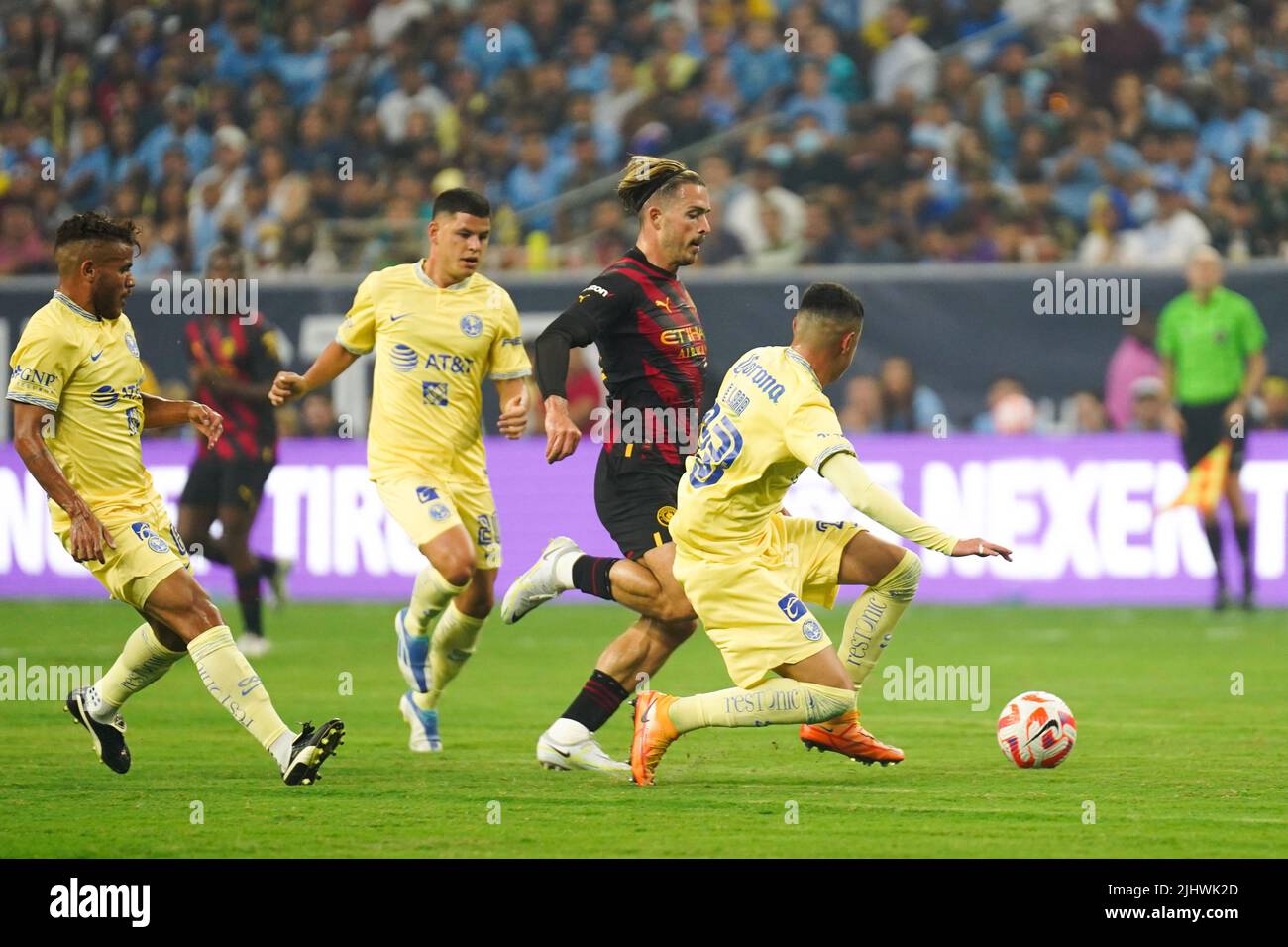 Manchester City's Jack Grealish (left) and Club America's Emilio Lara battle for the ball during a pre-season friendly match at NRG Stadium, Houston. Picture date: Wednesday July 20, 2022. Stock Photo