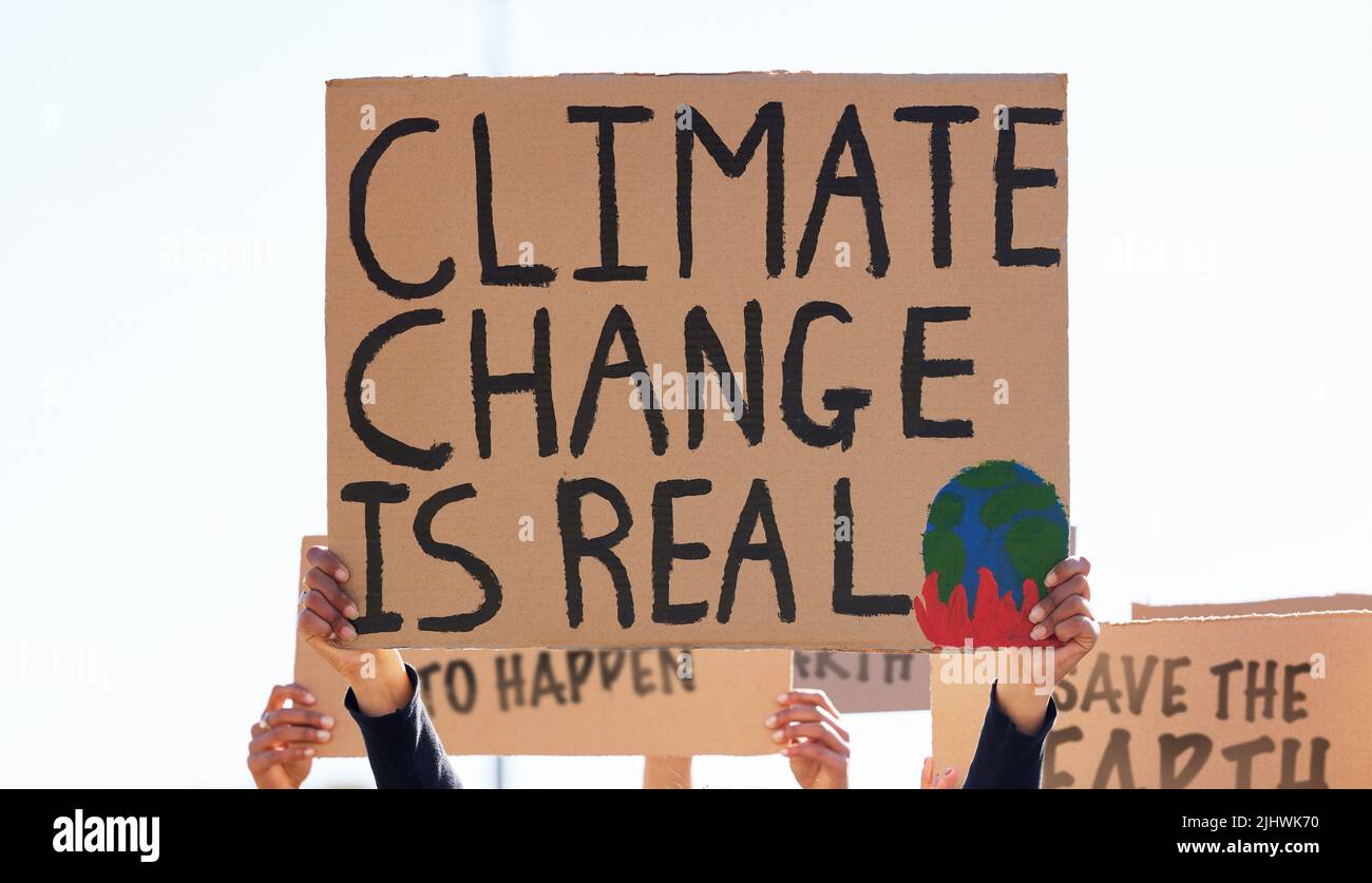 We will not grow tired. a group of people protesting climate change. Stock Photo