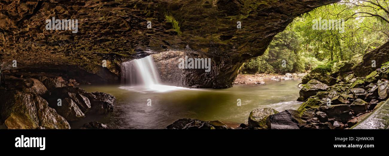 Natural Bridge in Springbrook National Park with waterfall. Stock Photo