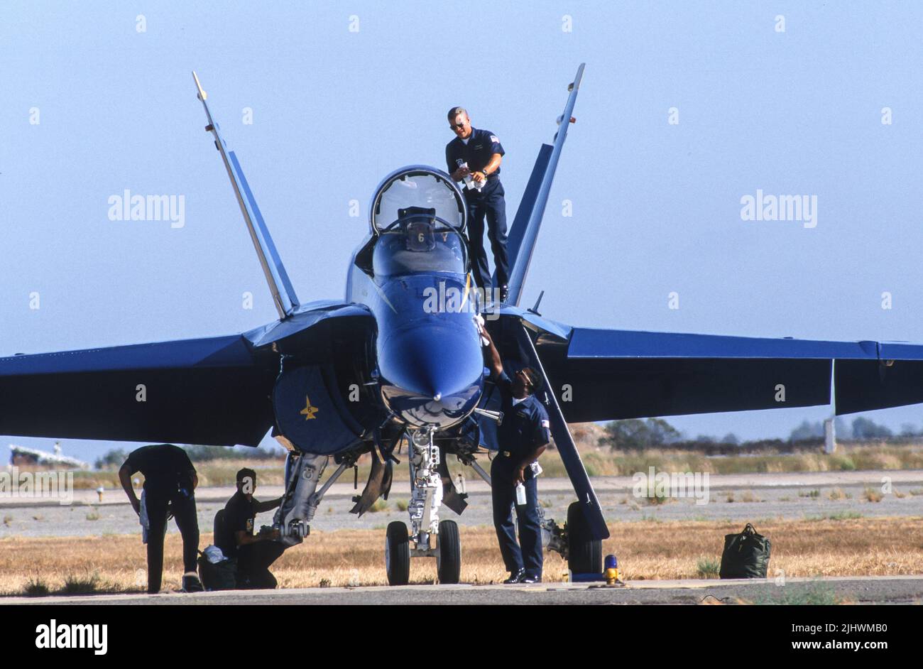 Blue Angels maintainers at work getting a F/A-18 Legacy Hornet ready for their flight demonstration Stock Photo
