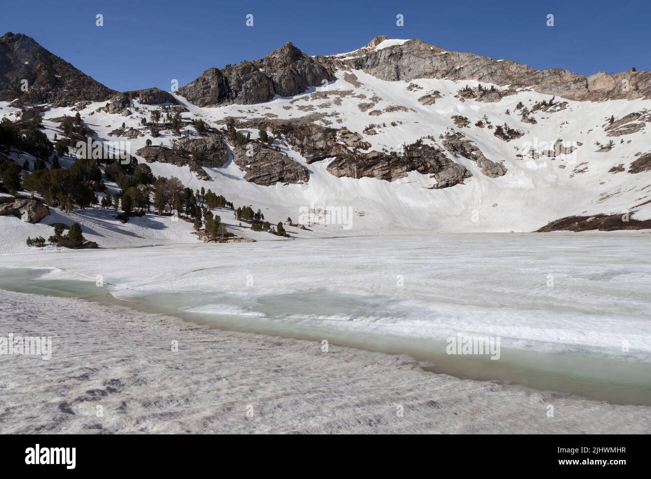 Frozen Lamoille Lake is a cirque at the headwaters of Lamoille Creek in Lamoille Canyon which is part of the Ruby Mountain Range in Nevada south of El Stock Photo