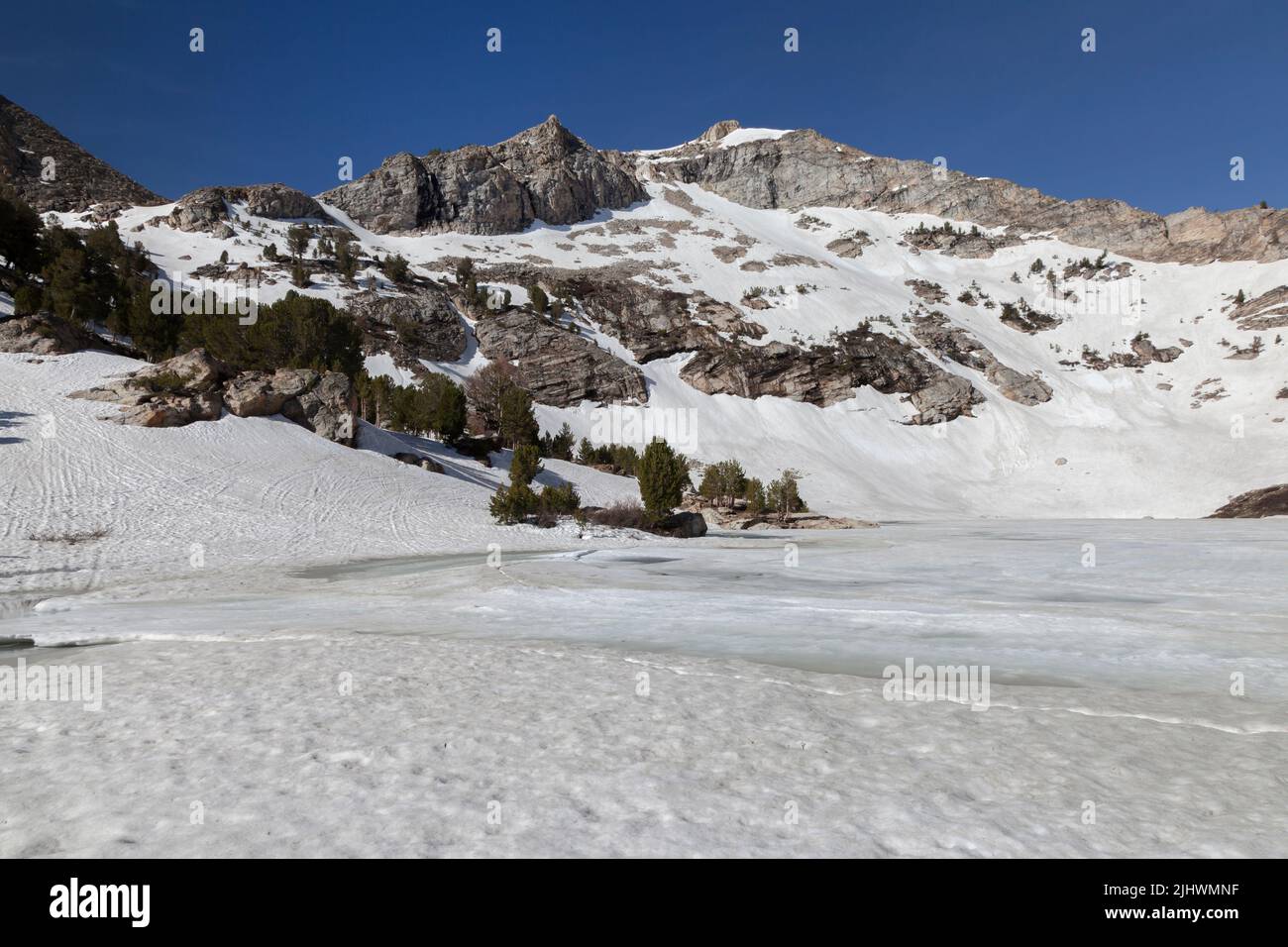 Frozen Lamoille Lake is a cirque at the headwaters of Lamoille Creek in Lamoille Canyon which is part of the Ruby Mountain Range in Nevada south of El Stock Photo