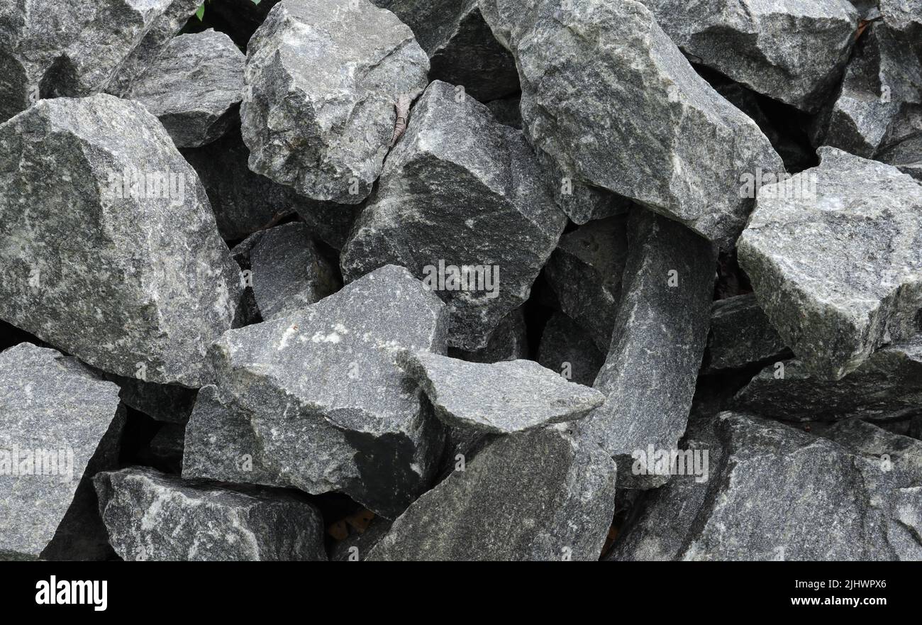 Close up of a pile of large crushed granite stones, to sell as building material Stock Photo