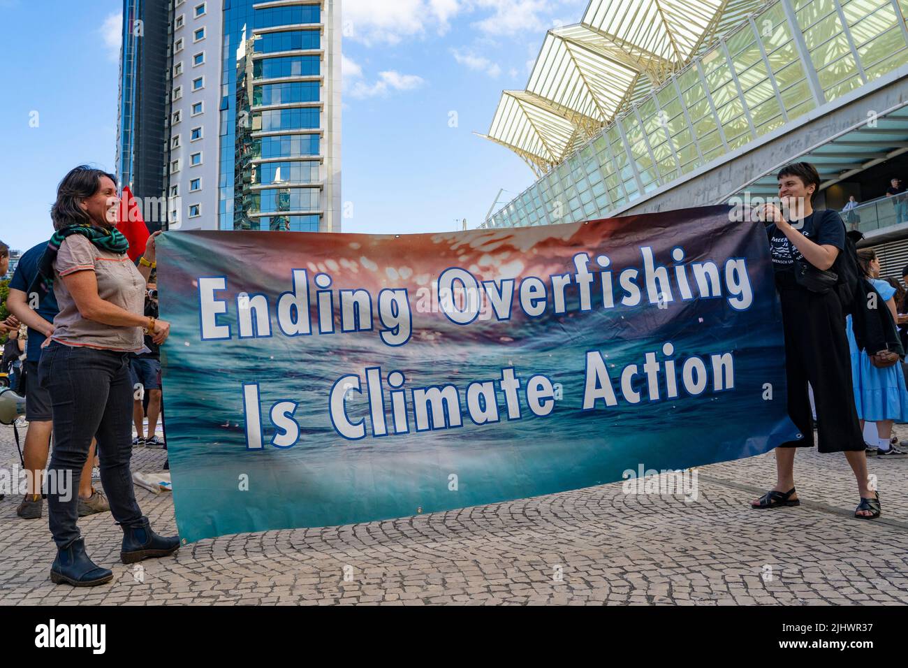 Ending overfishing is climate action Blue Climate March - protest by civil society at the UN Ocean Conference, Lisbon, June 29, 2022. Stock Photo