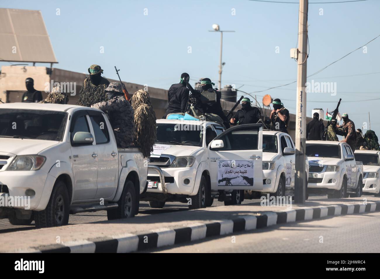 Gaza, Palestine. 20th July, 2022. Gunmen from the Izz al-Din al-Qassam Brigades, the military wing of Hamas, drive their cars during an anti-Israel military parade in Gaza City. Credit: SOPA Images Limited/Alamy Live News Stock Photo