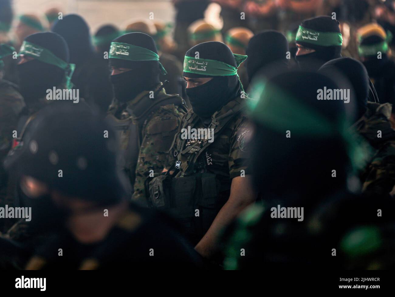 Gaza, Palestine. 20th July, 2022. Members of the Izz al-Din al-Qassam Brigades, the military wing of Hamas perform a prayer before the start of an anti-Israel military parade in Gaza City. Credit: SOPA Images Limited/Alamy Live News Stock Photo