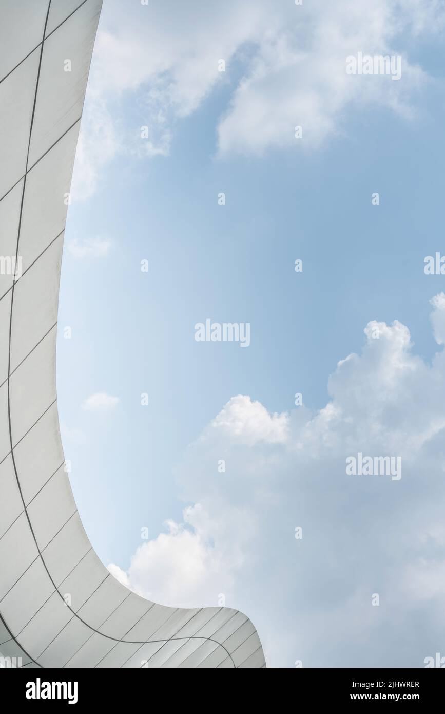 An edge of a modern building and a cloudy sky Stock Photo - Alamy