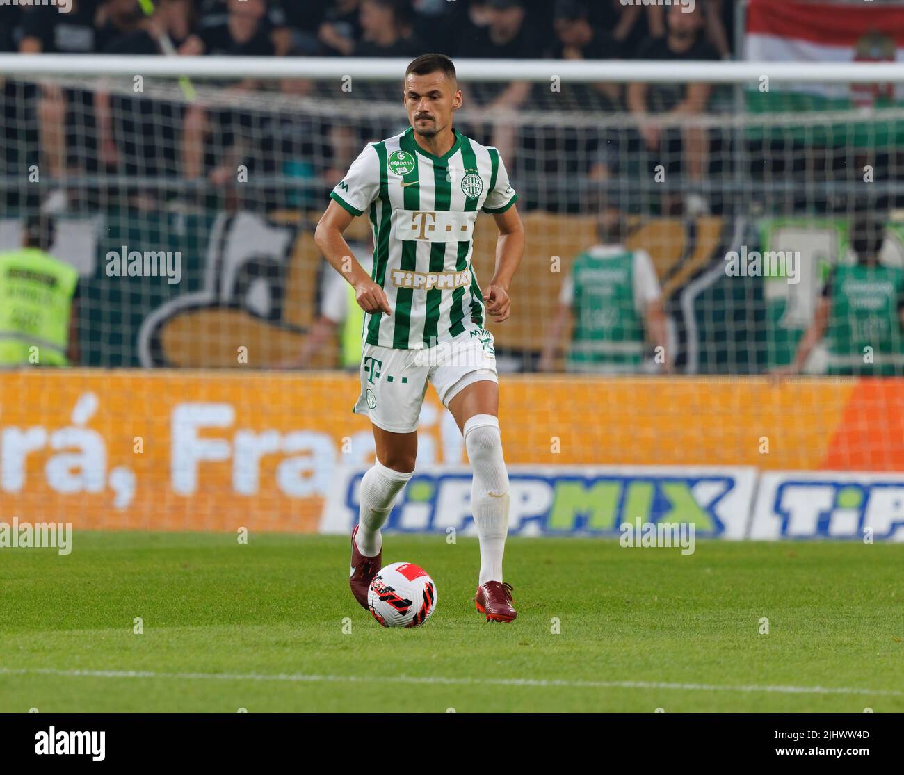 BUDAPEST, HUNGARY - JULY 20: Adnan Kovacevic of Ferencvarosi TC controls the ball during the UEFA Champions League Second Qualifying Round First Leg match between Ferencvarosi TC and SK Slovan Bratislava at Ferencvaros Stadium on July 20, 2022 in Budapest, Hungary. Stock Photo