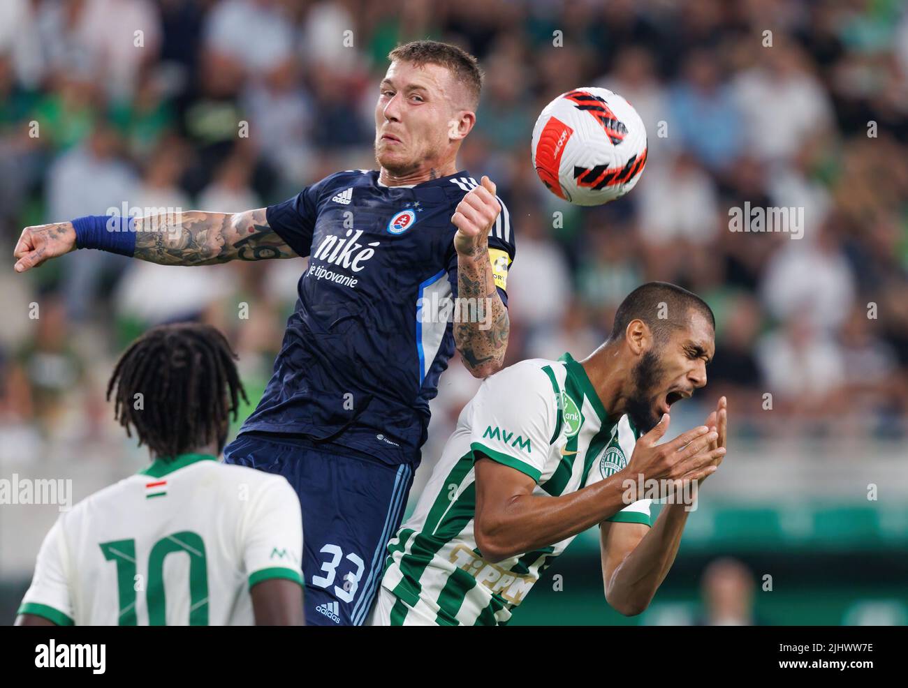 BUDAPEST, HUNGARY - JULY 20: Juraj Kucka of SK Slovan Bratislava battles for the ball in the air with Aissa Laidouni of Ferencvarosi TC during the UEFA Champions League Second Qualifying Round First Leg match between Ferencvarosi TC and SK Slovan Bratislava at Ferencvaros Stadium on July 20, 2022 in Budapest, Hungary. Stock Photo