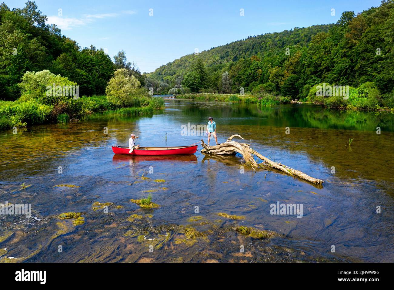 Tourists enjoying during canoe trip on a beautiful summer day on idyllic Krka river in Slovenia Stock Photo