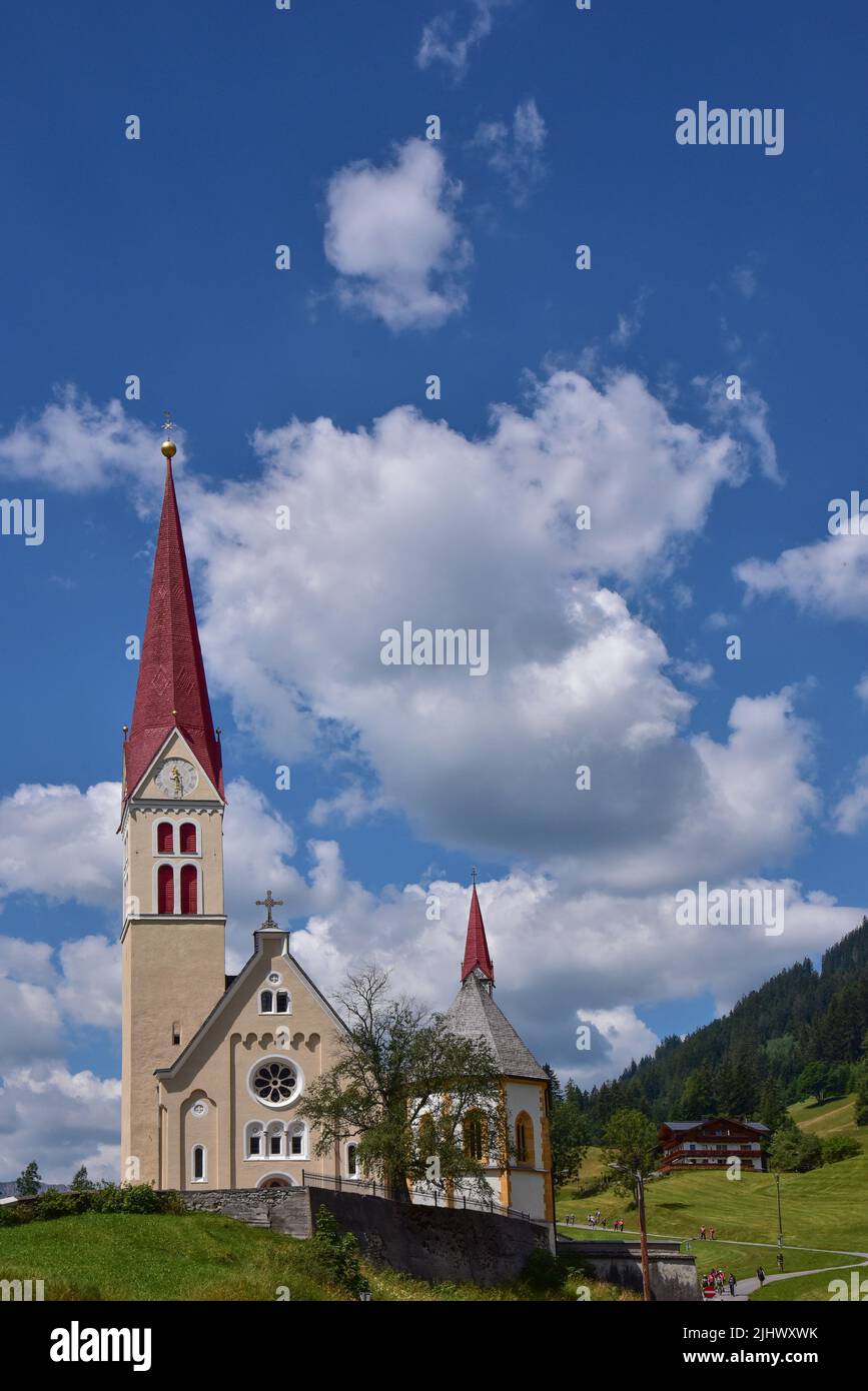 Parish Church of the Assumption of the Virgin Mary with Chapel of St. Sebastian in Holzgau in the Lech Valley, Tyrol, Austria, Europe Stock Photo