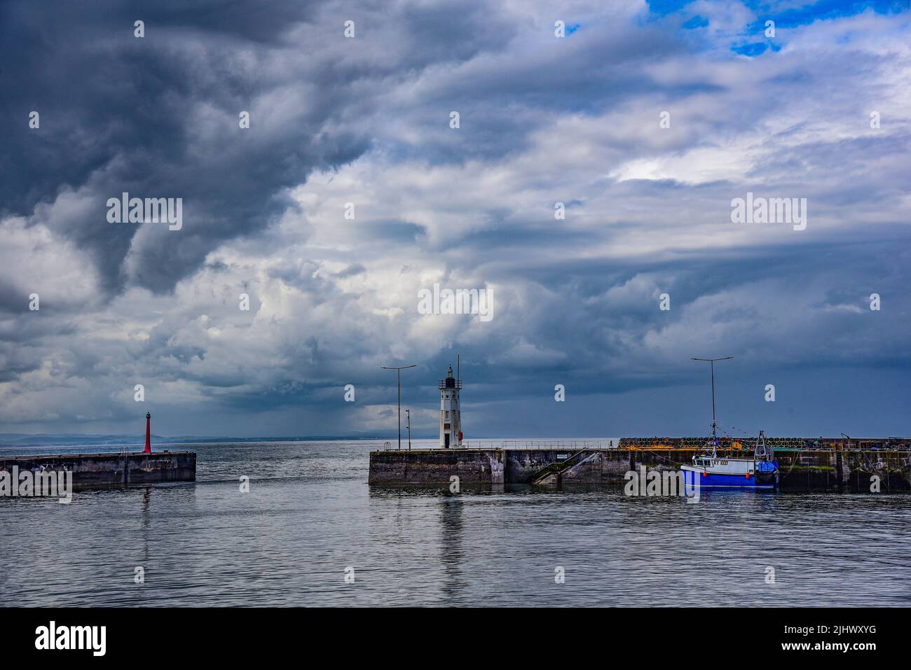 Rain clouds in front of the harbor in the fishing village of Antruther, Fife, Scotland, United Kingdom, Europe Stock Photo