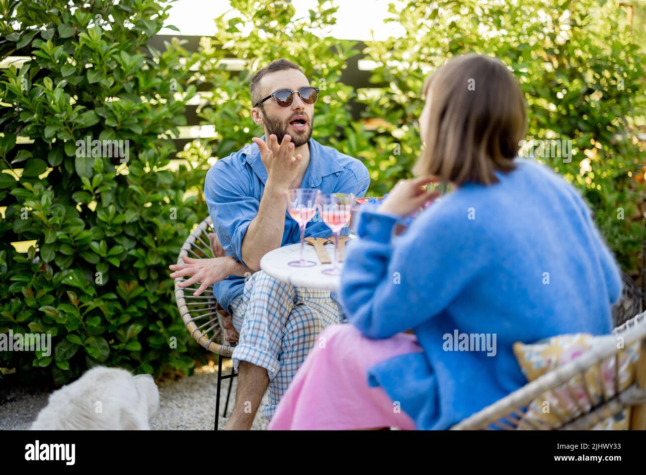 Stylish couple spend romantic evening at backyard Stock Photo