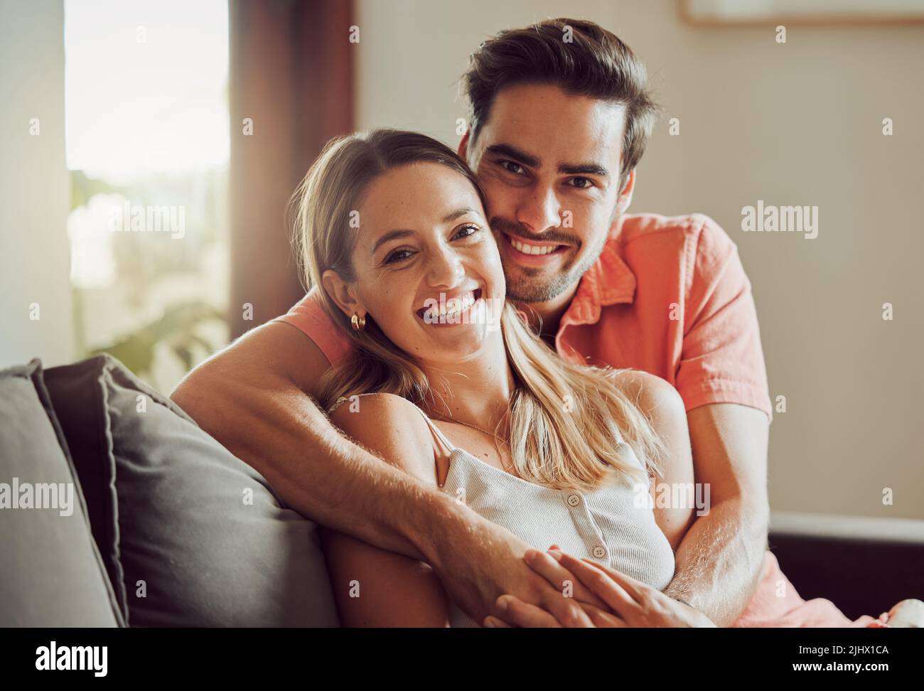 Growing together. a young couple spending time together at home. Stock Photo