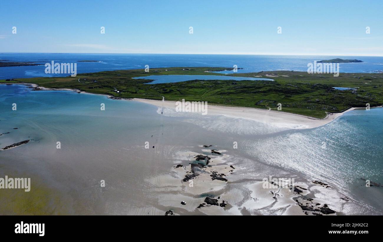 An aerial view of a green land surrounded by sea Stock Photo Alamy