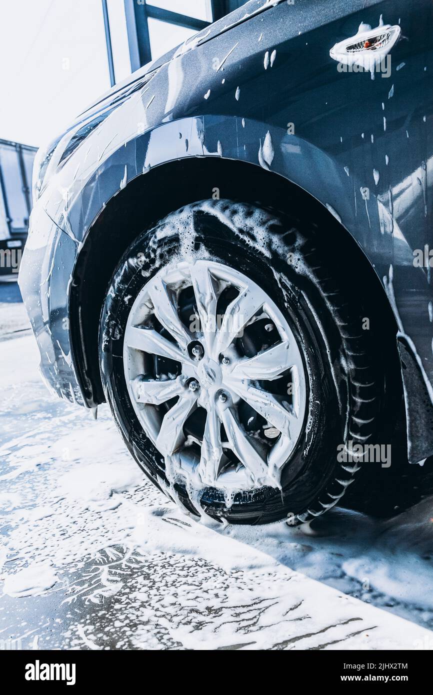 Tires and wheels of a car at a self-service car wash close-up Stock ...