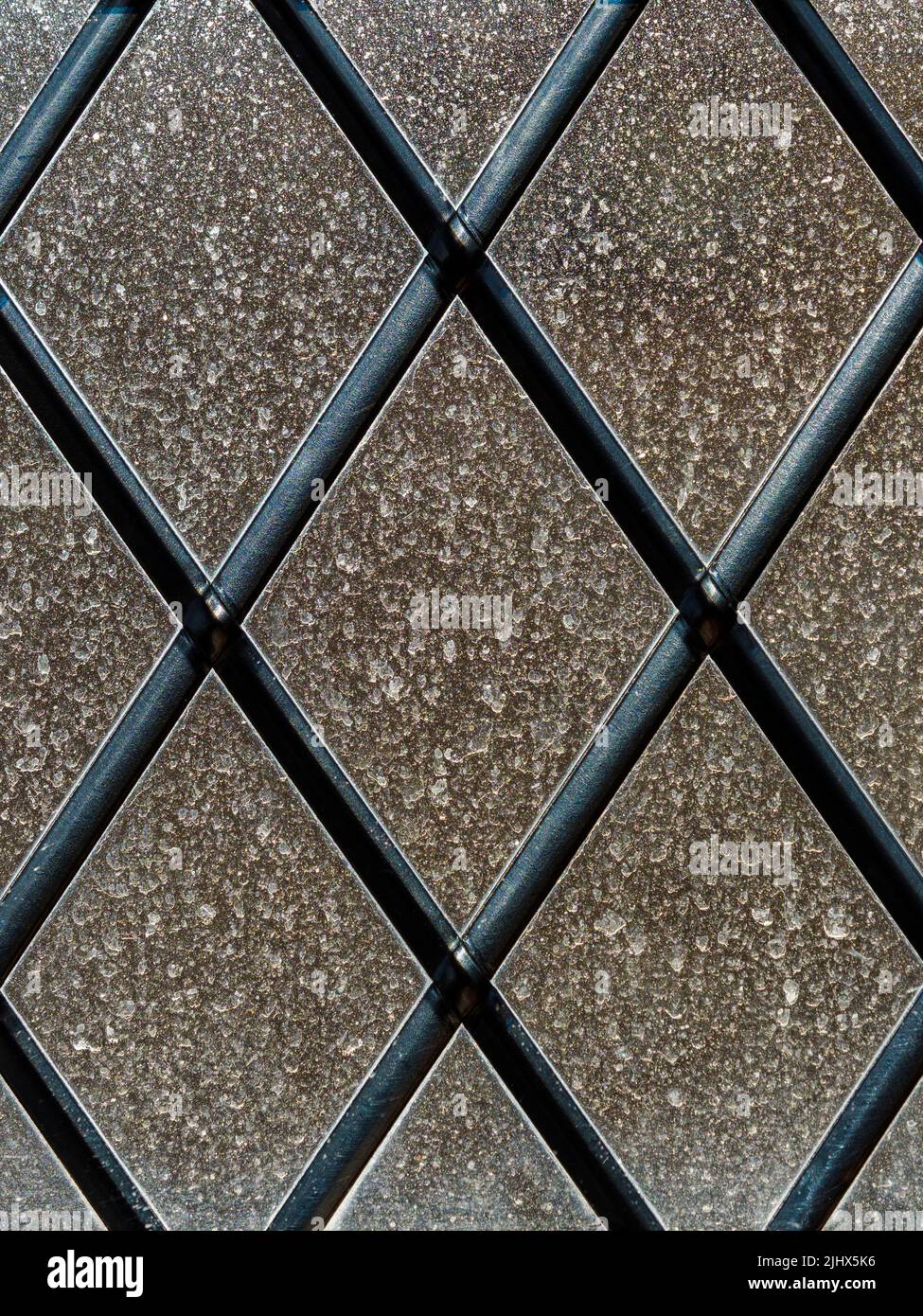 Backlit view of sahara dust on a lattice window, Cambridgeshire, England Stock Photo
