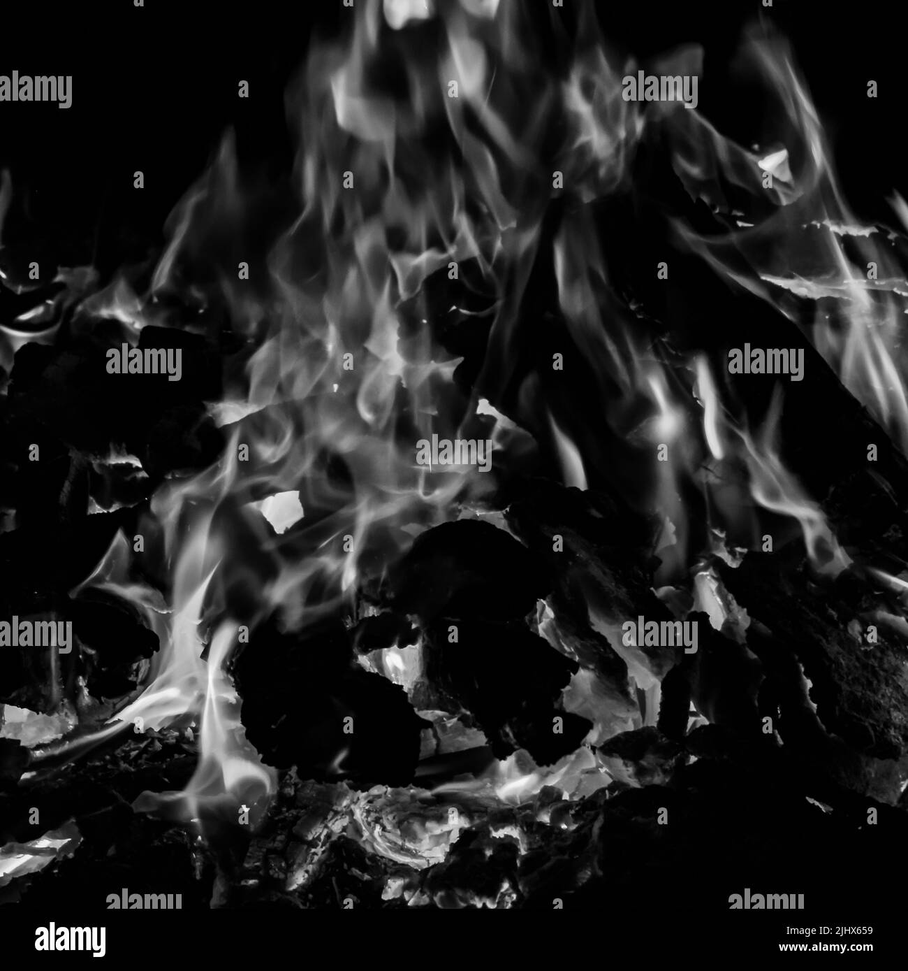 Fire flames on black background, Blaze fire flame texture background, Beautifully, the fire is burning, Fire flames with wood and cow dung bonfire Bla Stock Photo