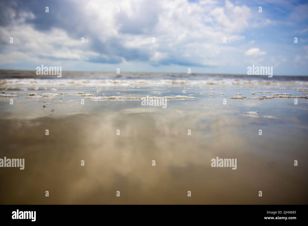 A Reflected sky in the tide pools at the beach. Jekyll Island, GA Stock