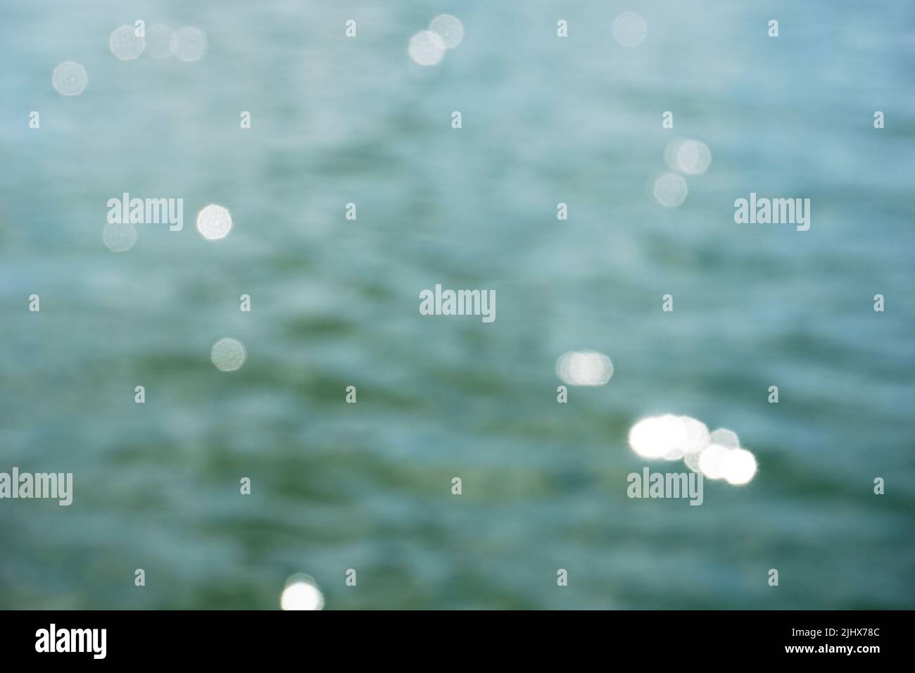 Sun reflecting in water surface - bokeh effect Stock Photo