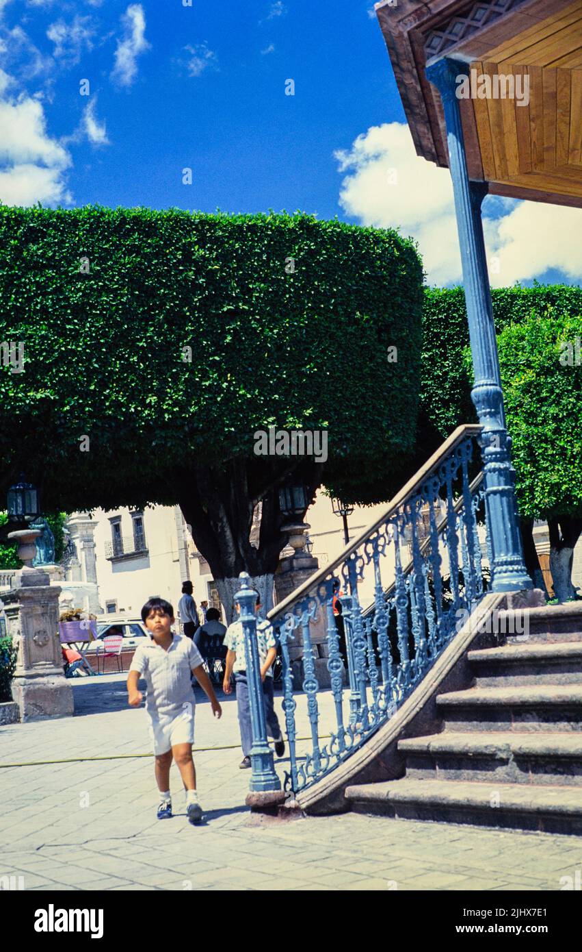 San Miguel de Allende, Mexico, photo from 1990 boy walking by bandstand in El Jardin Stock Photo