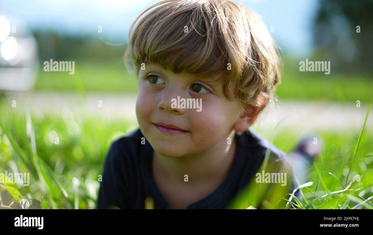 Little boy on grass portrait outside, cute little child Stock Photo - Alamy