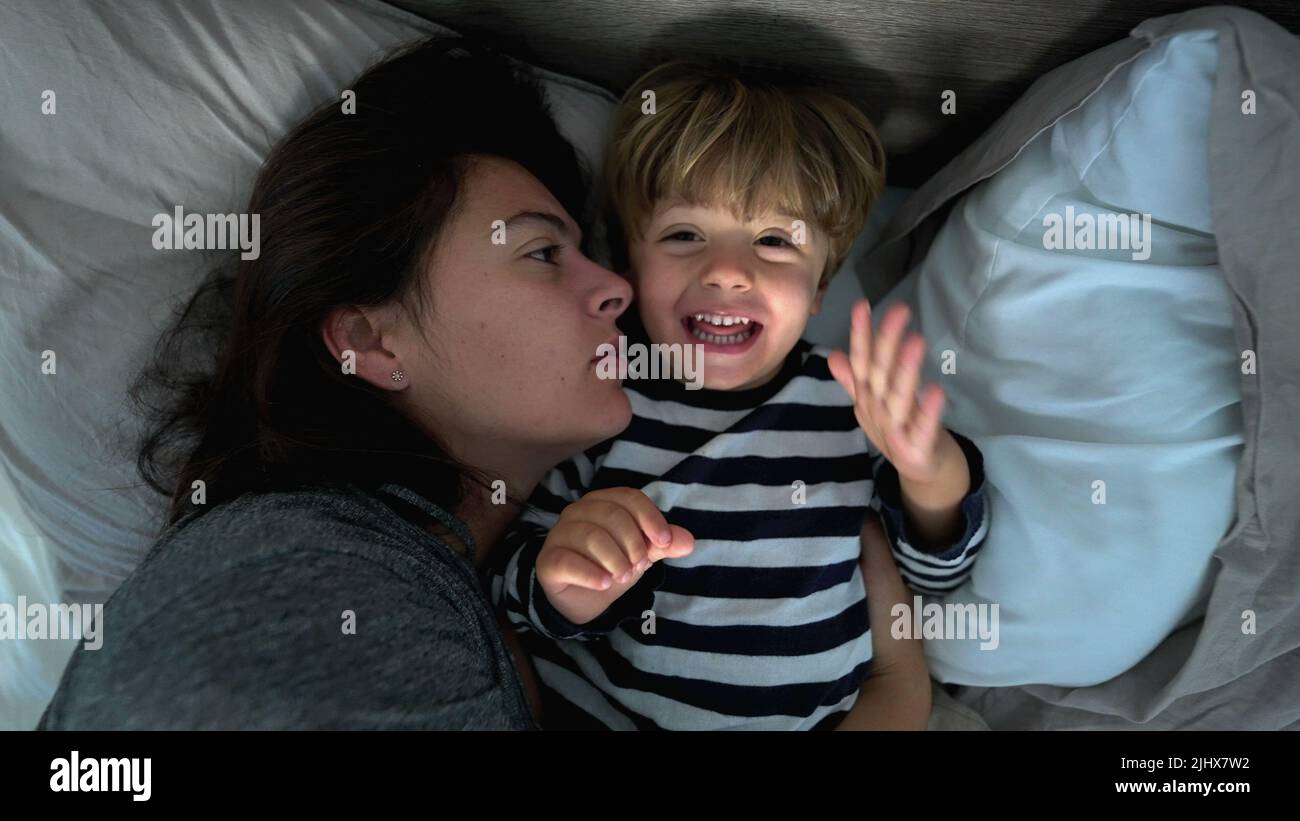Mother and child son in morning bed love care and affection Stock Photo