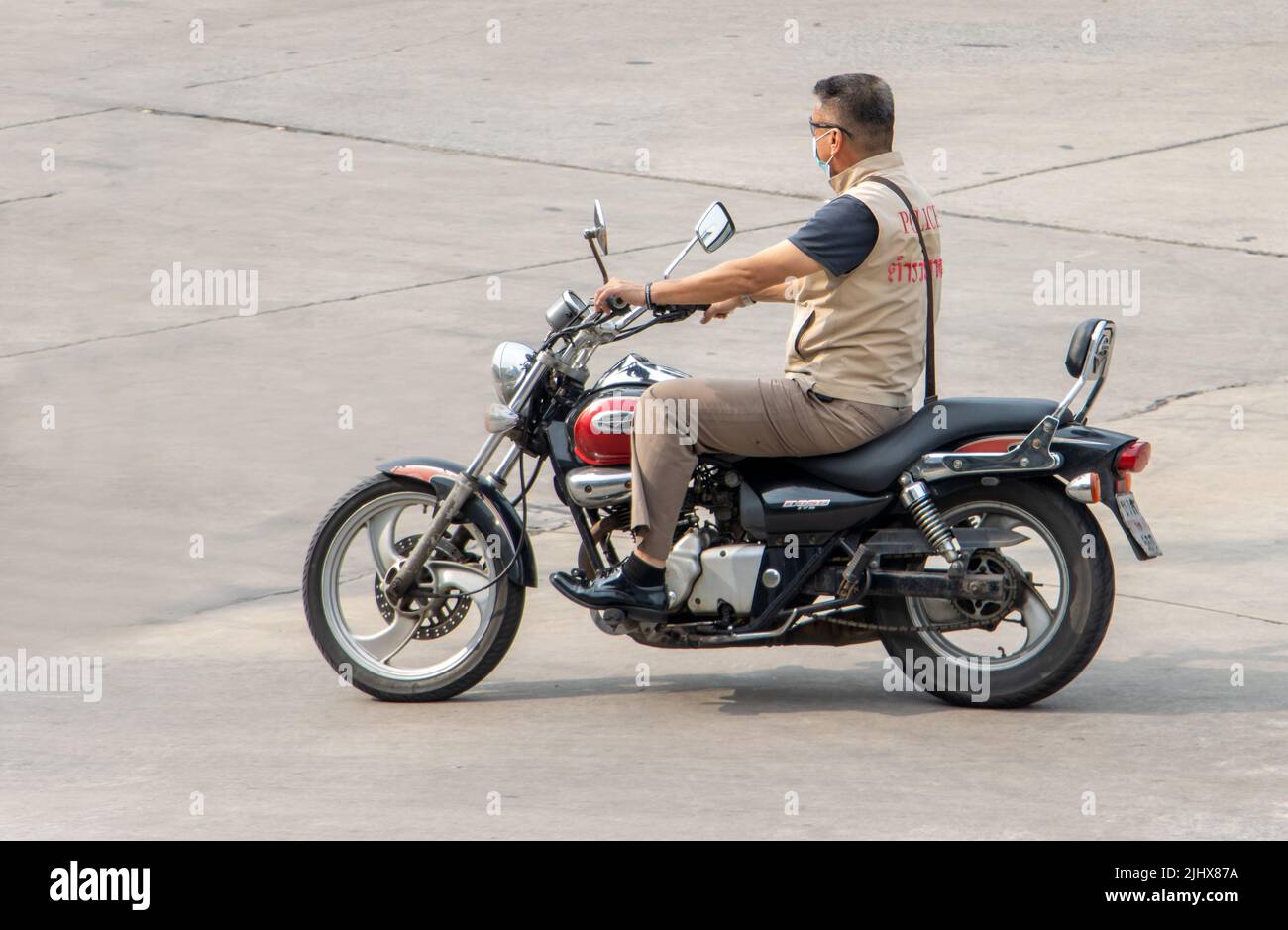 SAMUT PRAKAN, THAILAND, APR 19 2022, A man rides a motorcycle at the road Stock Photo